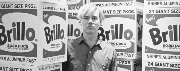 Image: Andy Warhol with a lot of big packets of Brillo's Soap